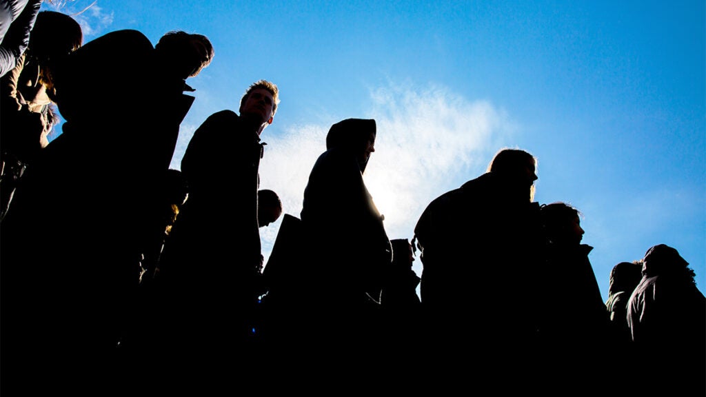 Silhouettes of students walking out in protest of gun violence